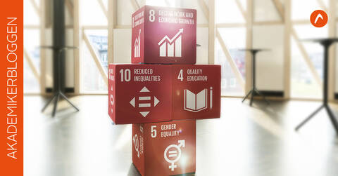 Fyra röda kuber med direktiv från Agenda 2030.
